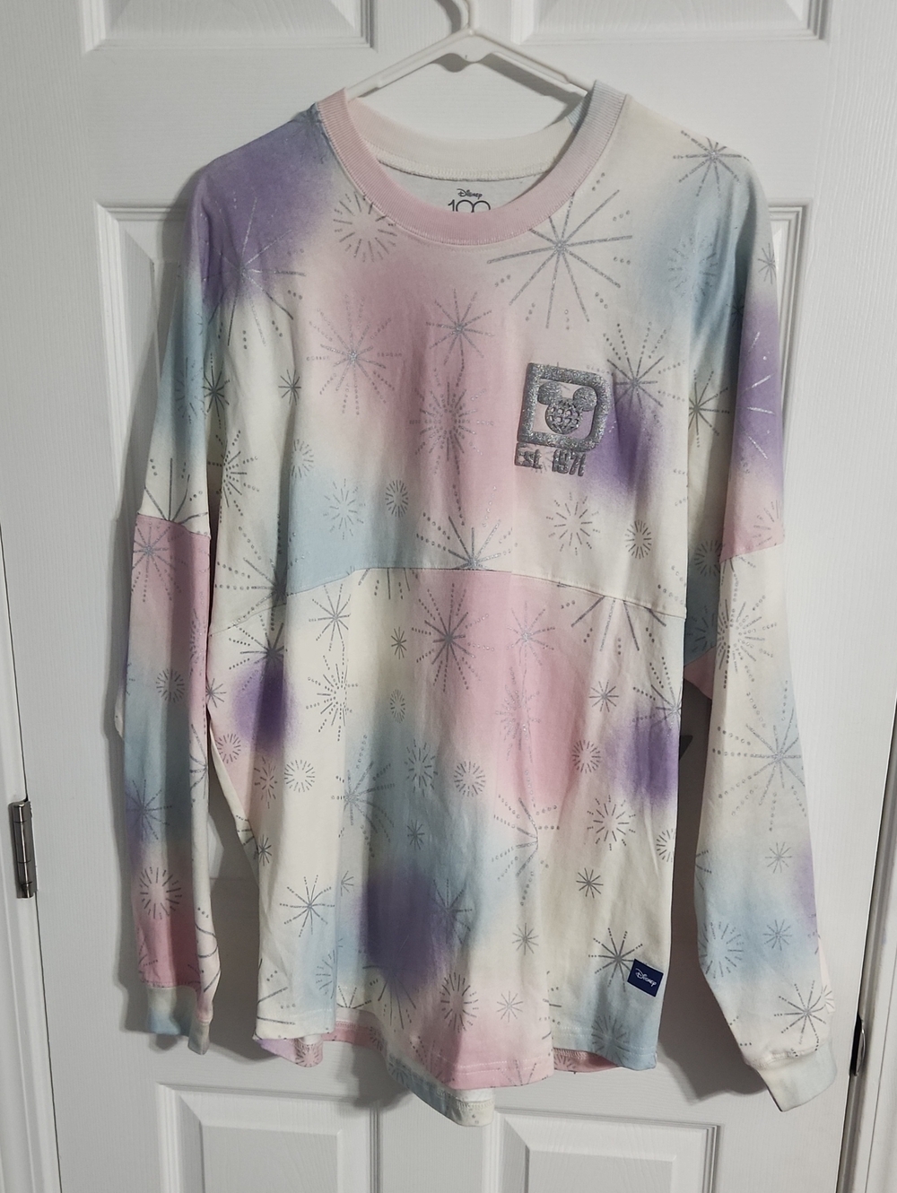 NWT. Disney 100 Years Of Wonder Fireworks Spirit Jersey Adult Sz.L Unisex Pastel